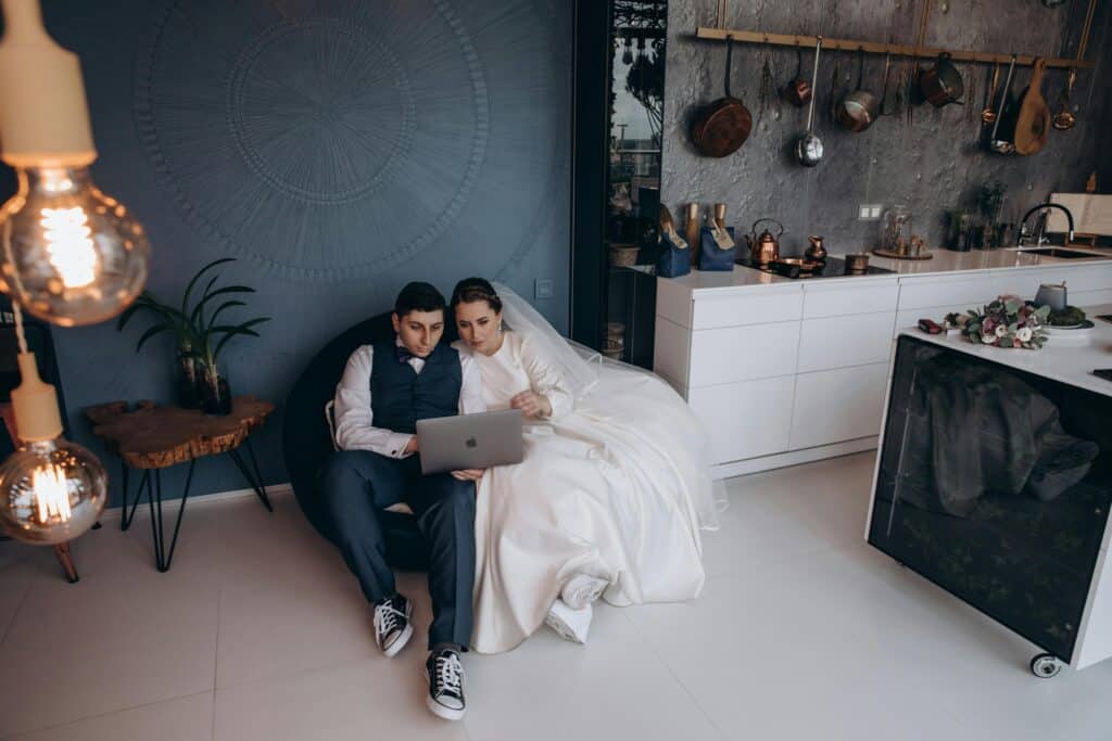 A couple planning their wedding online – why you need a wedding website