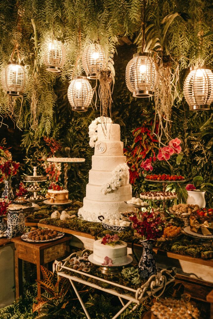 A gorgeous multi-layered wedding cake amidst a wonderful, plentiful and yummy spread